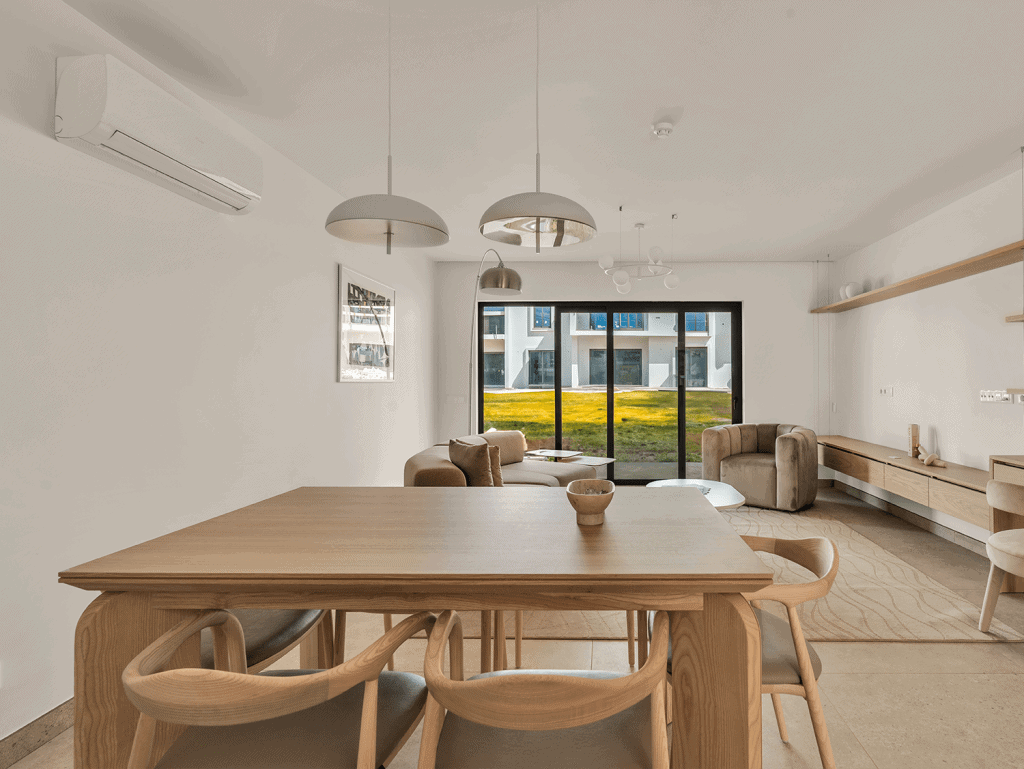 Bright interior of a modern Algarve apartment featuring a spacious living area and large window with.