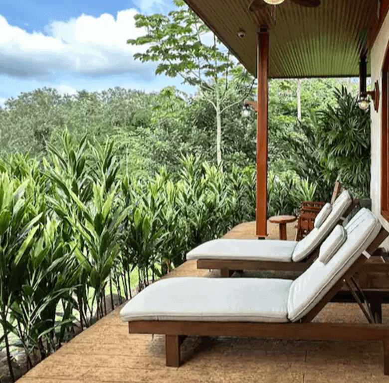 Relaxing outdoor lounge with lush jungle views in La Fortuna, Costa Rica.