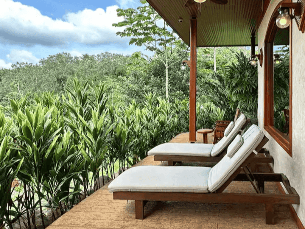 Relaxing outdoor lounge with lush jungle views in La Fortuna, Costa Rica.