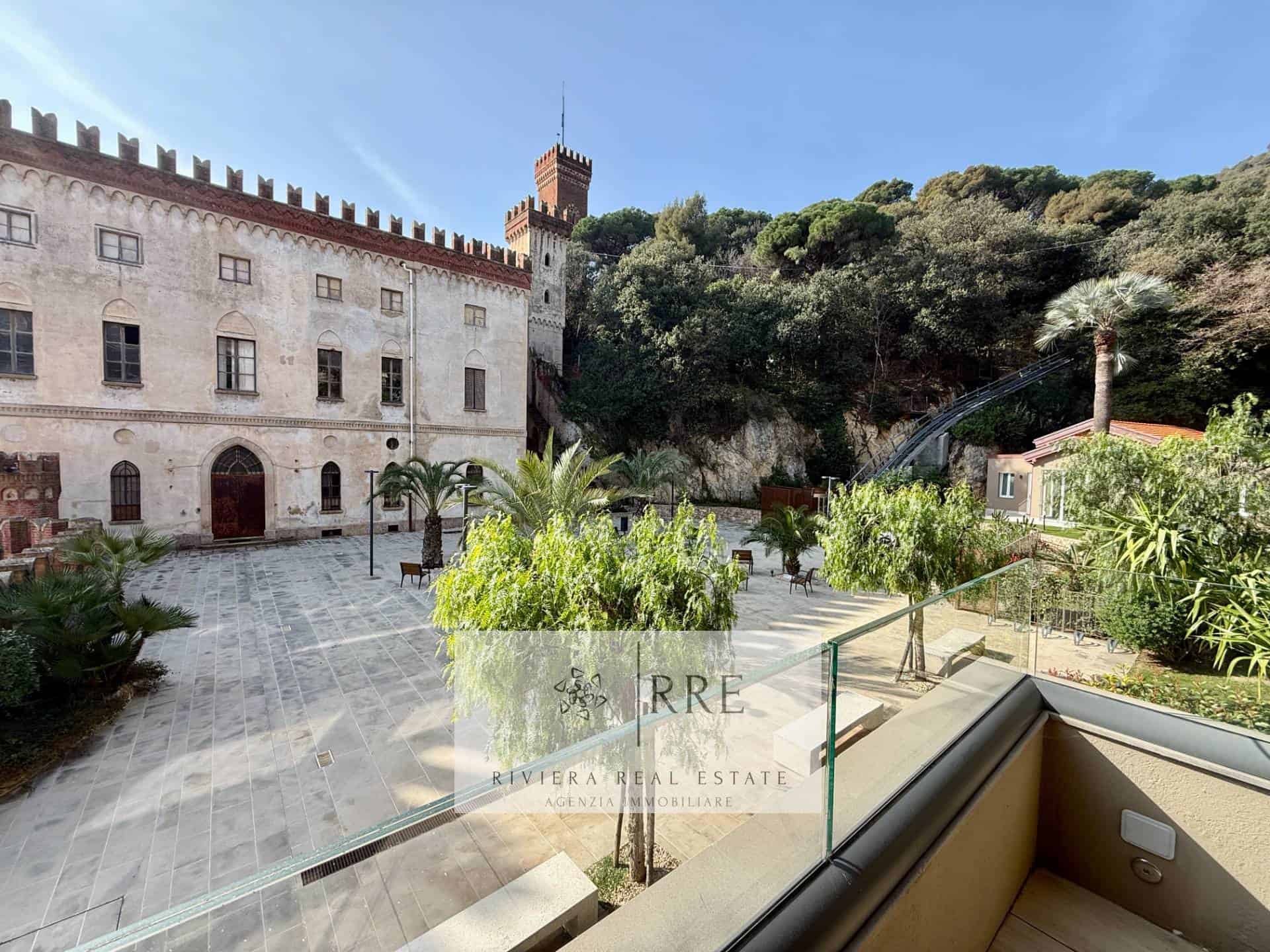 Historic castle with lush gardens and scenic hillside views.