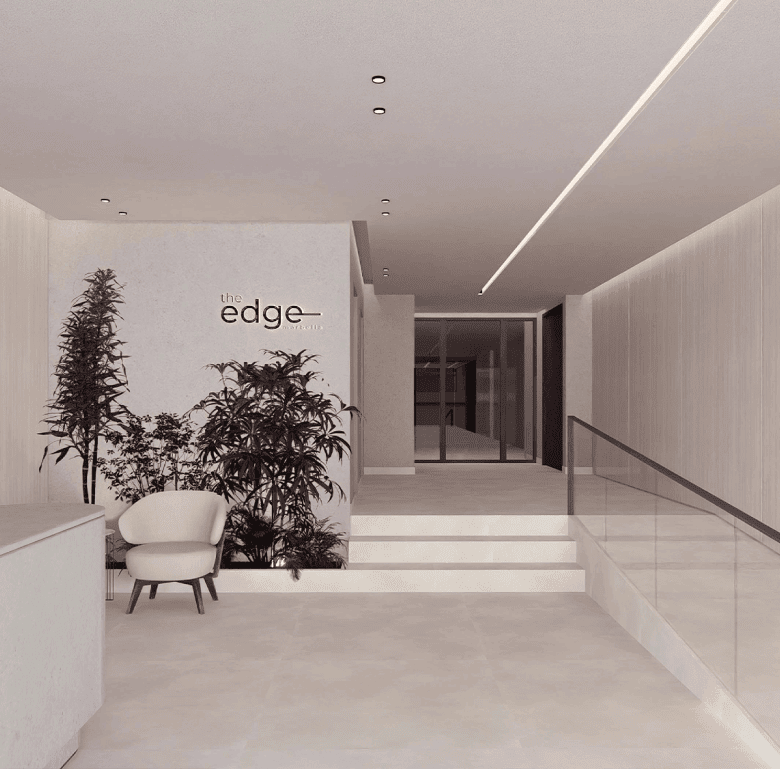 Modern lobby entrance of The Edge residential building in Panama City, featuring minimalist design a.