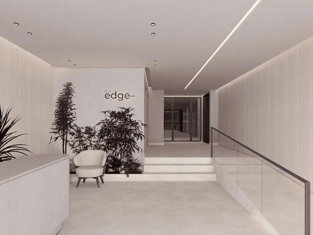 Modern lobby entrance of The Edge residential building in Panama City, featuring minimalist design a.