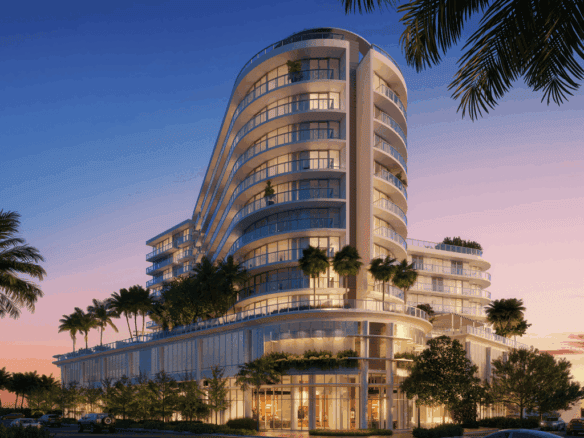 Modern Miami residential building with ocean views and lush landscaping.