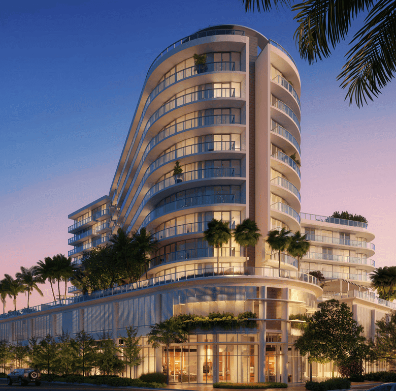 Modern Miami residential building with ocean views and lush landscaping.