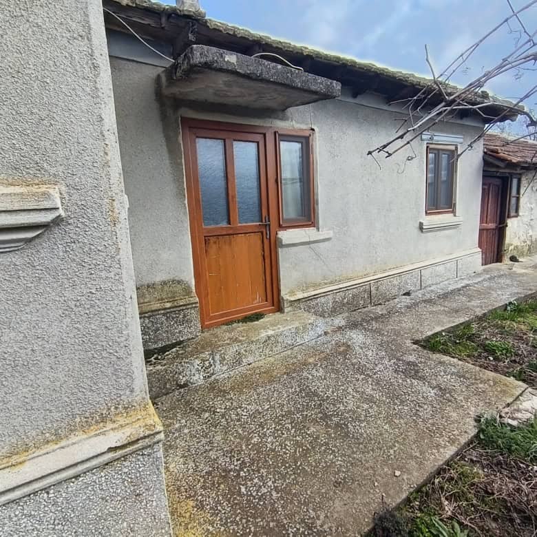 Traditional rural house with wooden door and small windows near the Black Sea.