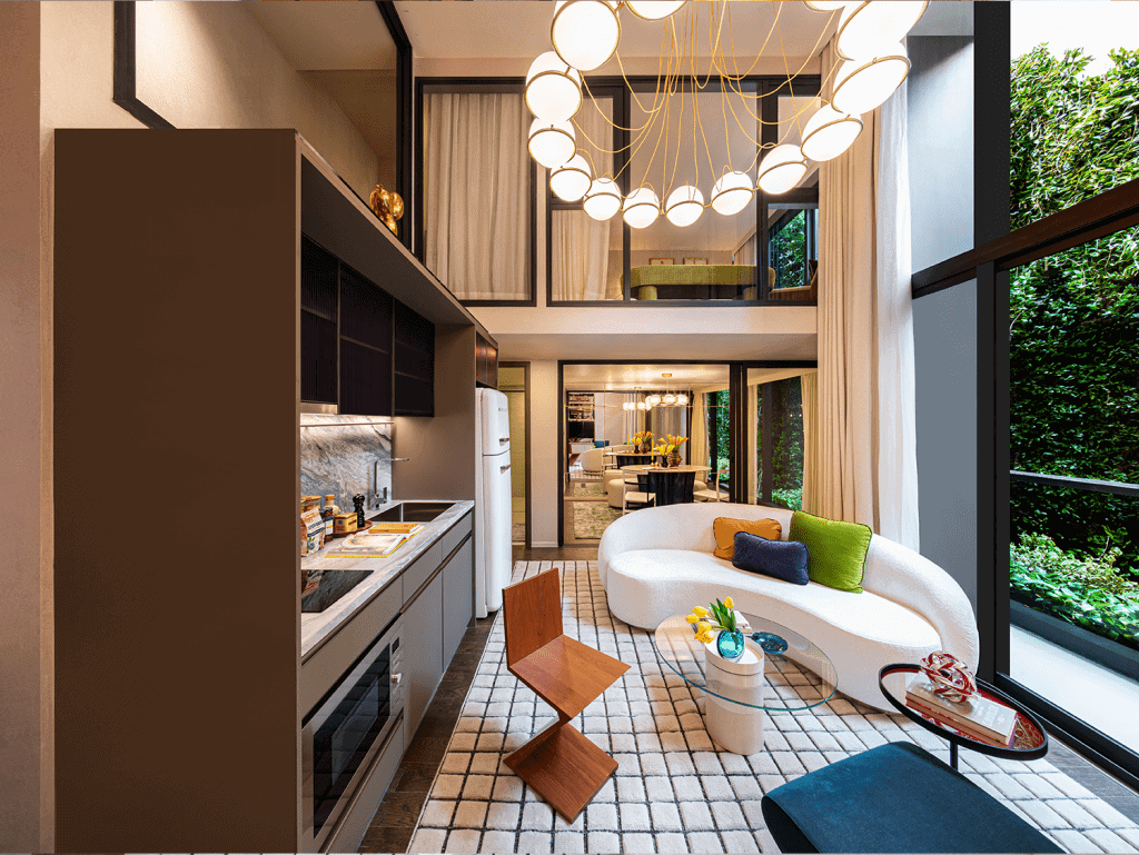 Stylish Bangkok apartment interior featuring contemporary furniture, large windows, and lush greener.