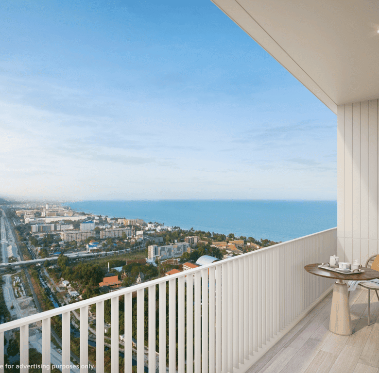 Sea view balcony in Hua Hin, Thailand, with outdoor furniture and panoramic ocean scenery.