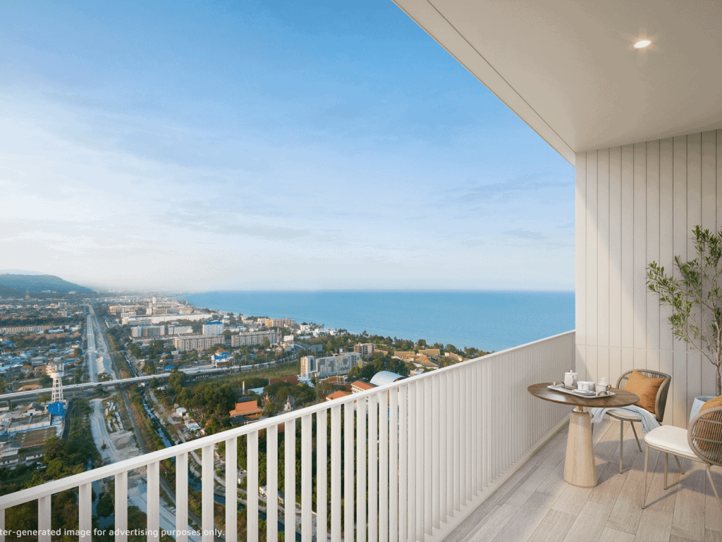 Sea view balcony in Hua Hin, Thailand, with outdoor furniture and panoramic ocean scenery.