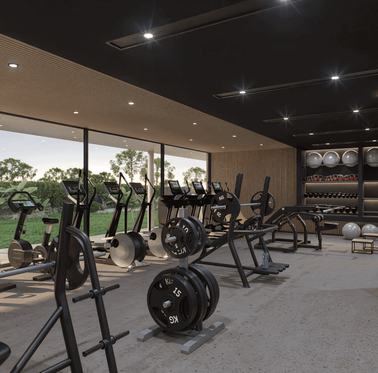 Indoor gym with exercise machines and weights at Manglar Albor, Punta Del Este, Uruguay.