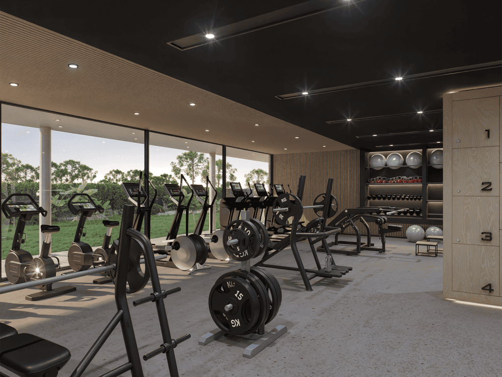Indoor gym with exercise machines and weights at Manglar Albor, Punta Del Este, Uruguay.