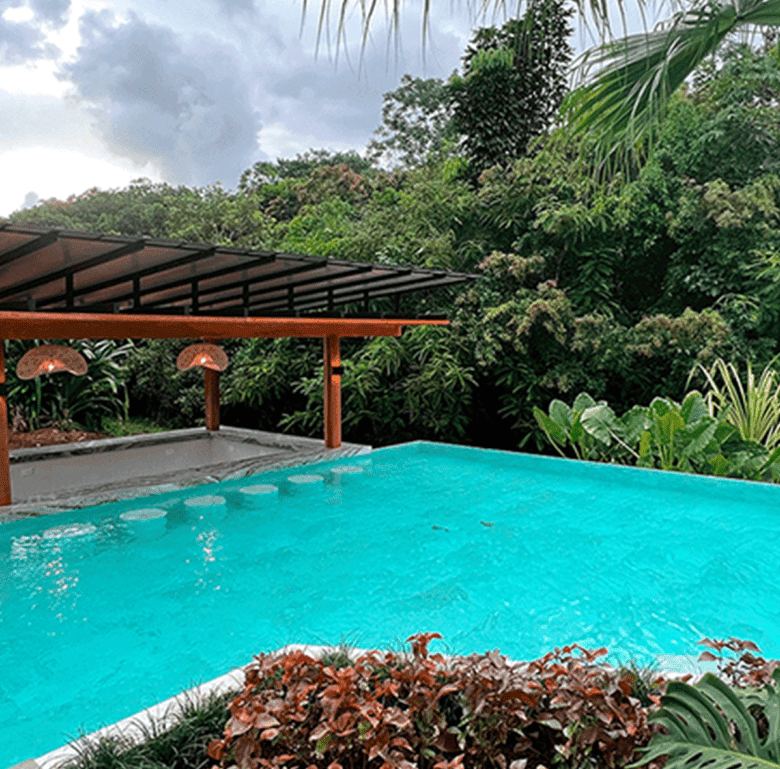 Pool with lush tropical surroundings in La Fortuna, Costa Rica.