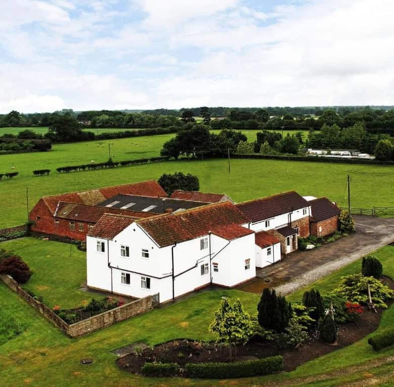 Beautiful countryside farmhouse with extensive land and lush gardens. Perfect for rural living or in.