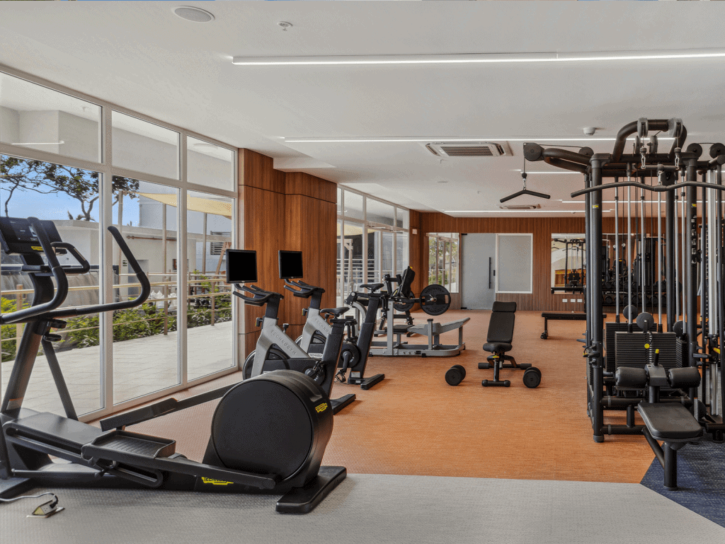 Gym interior with cardio and strength training equipment at Surfside - Playa Caracol, Panama.