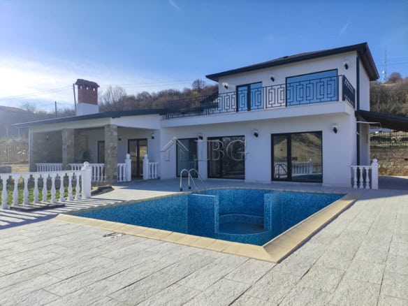 Luxury 3-bed, 3-bath house in Balchik featuring a private pool and scenic sea views. Perfect for com.