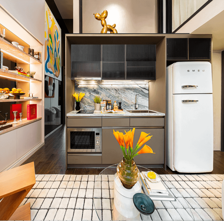 Modern kitchen with vintage fridge and colorful decor in Bangkok apartment.