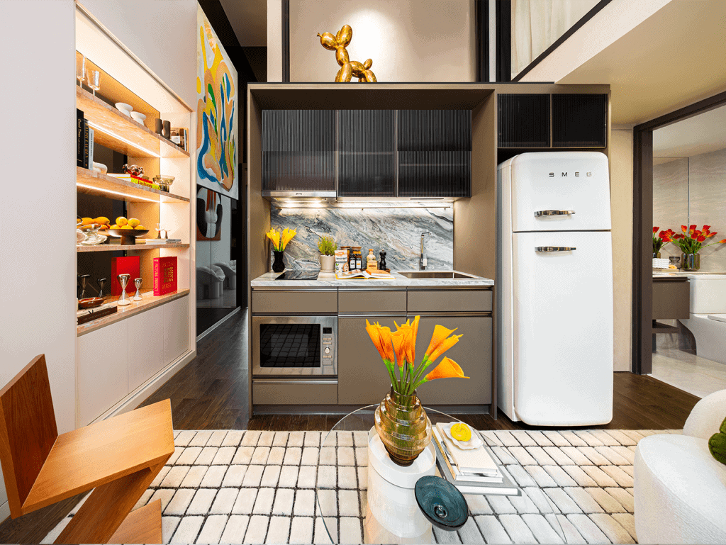 Modern kitchen with vintage fridge and colorful decor in Bangkok apartment.