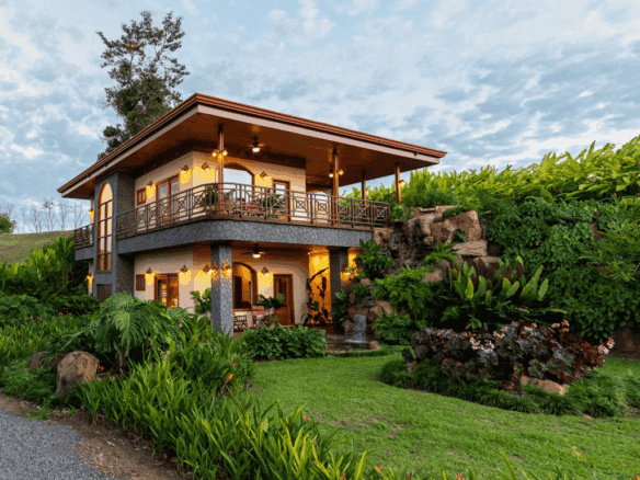 Beautiful Costa Rican villa with lush gardens, waterfall, and spacious balcony in Arenal Hills, La F.
