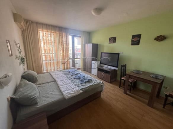 Cozy studio apartment with living area, TV, and dining space in Panorama Bay 1, Sveti Vlas.