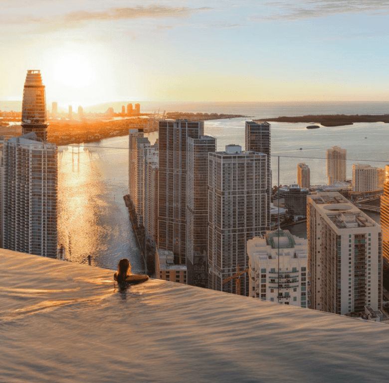 Luxury Miami skyline with city and water views from Faena Residences rooftop pool.