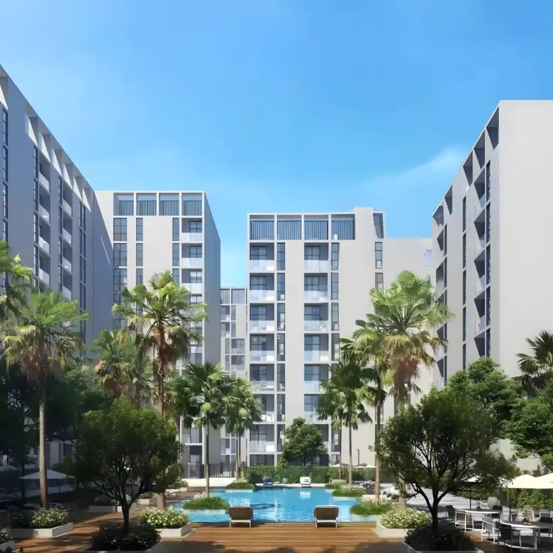 Beautiful view of Nama 3 residential complex with lush greenery and swimming pool in Sharjah UAE.