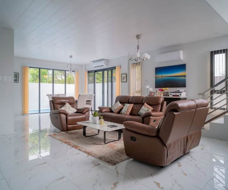 Spacious living room with modern furniture in a luxury villa at The Orchard Golf and Country Club, D.