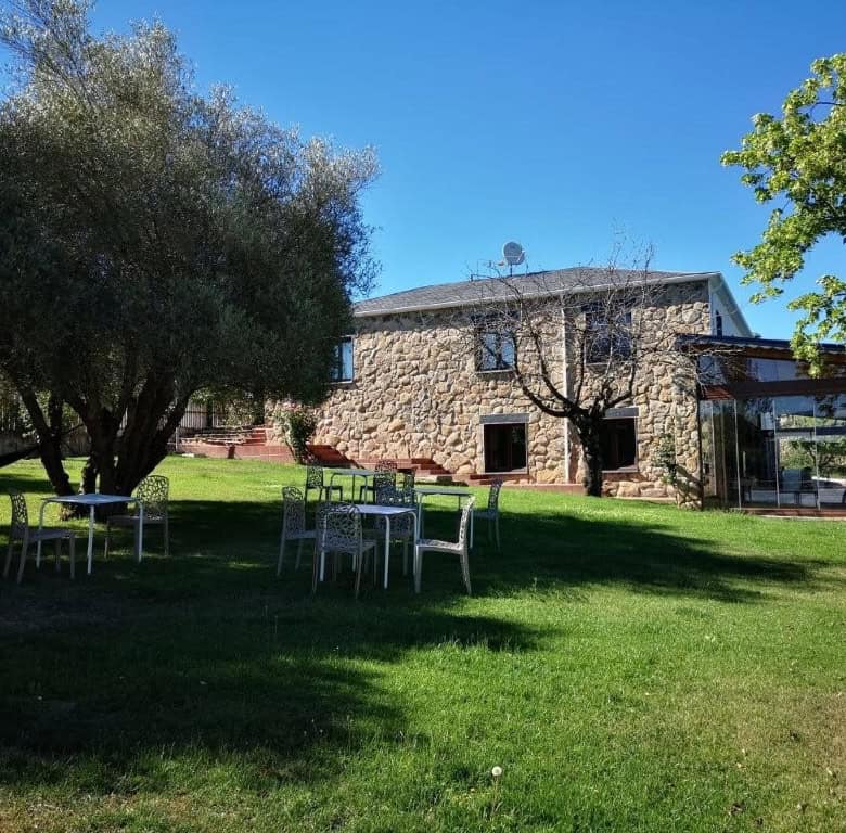 Luxury Finca Vivaldi Hotel for Sale in Leon, Spain, featuring stunning architecture and lush gardens.