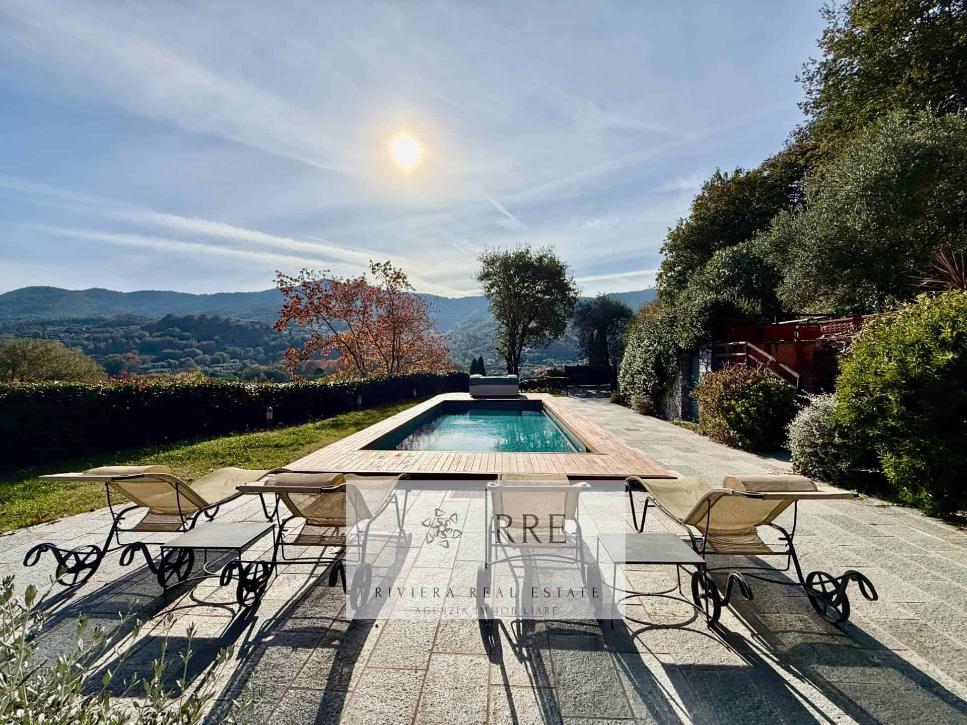 Luxury villa with pool and mountain views for sale in a scenic location.