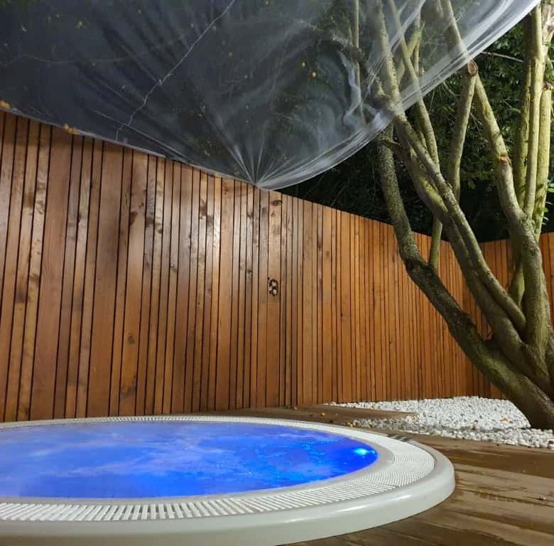 Luxury finca hotel with private pool in Leon, Spain, surrounded by nature and modern wooden fencing.