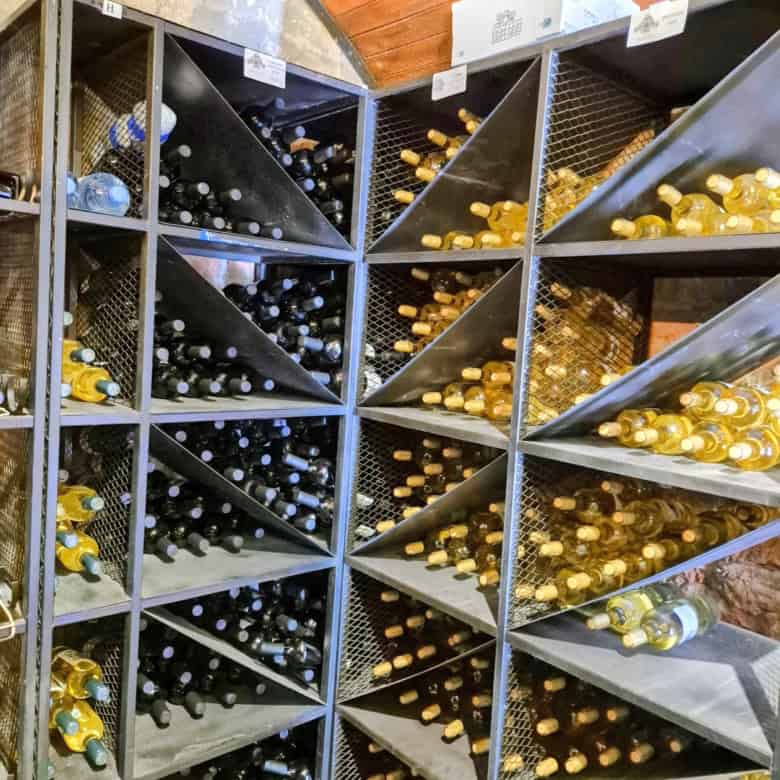 Wine bottle storage in a cellar or shop.