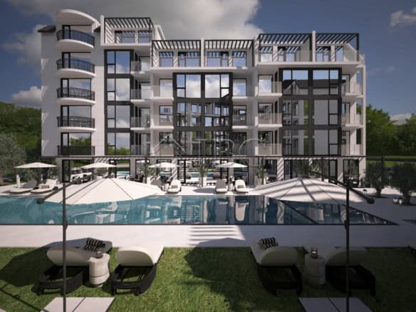 Elegant luxury apartment with pool and outdoor lounging area.