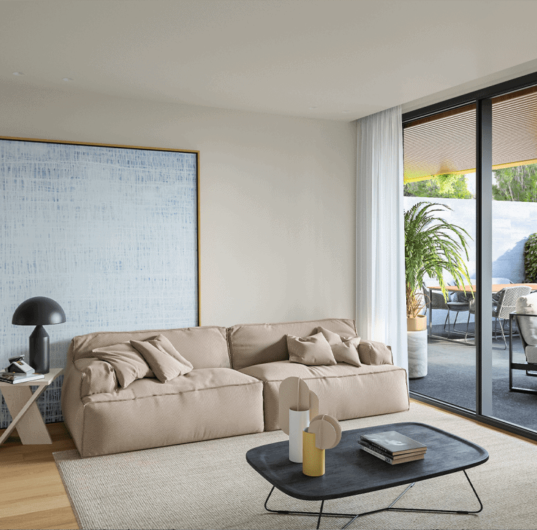 Spacious living room with beige sofa, coffee table, and balcony view in Porto, Portugal.
