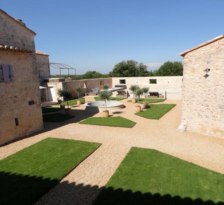 Elegant estate with lush gardens and stone buildings in Goudargues, Le Gard, France.