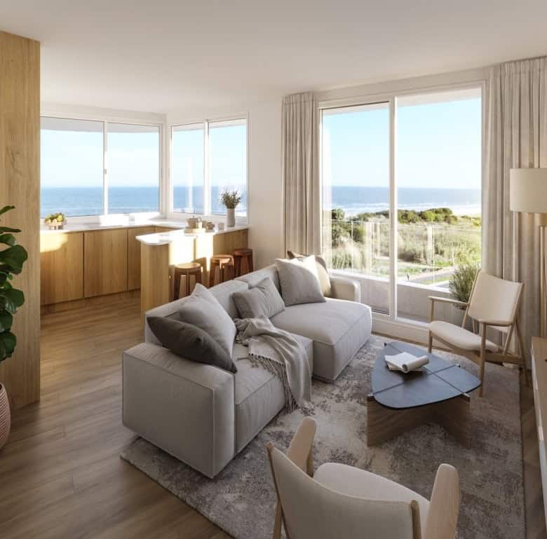 Ocean view living room with large windows and contemporary furniture in Montevideo, Uruguay.