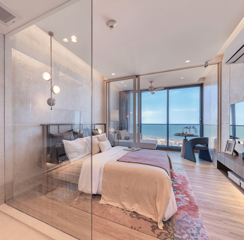 Sea view bedroom in Hua Hin, Thailand with stylish decor and glass walls.