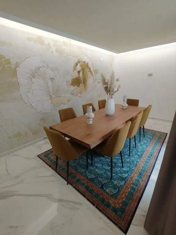 Elegant dining room with modern decor and artwork in Bernalda Italy.