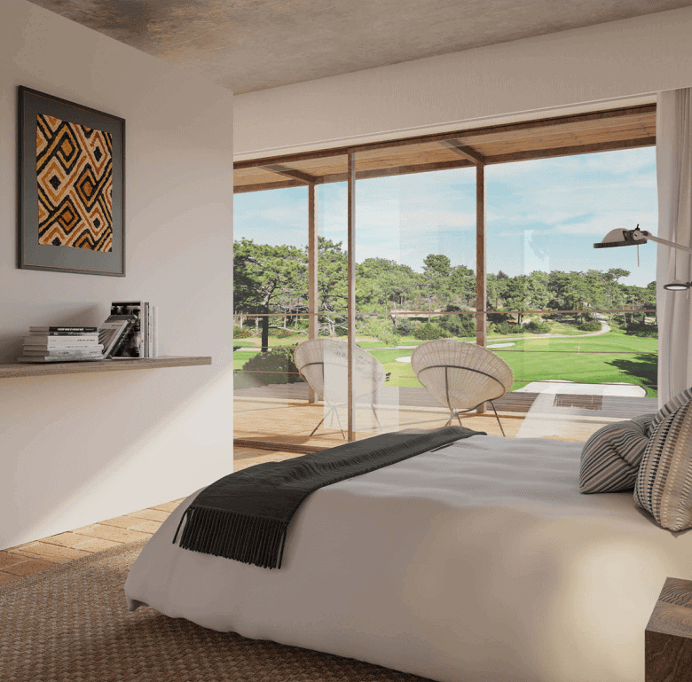Bright bedroom with large glass windows overlooking lush green landscape in Ferragudo Village, Algar.