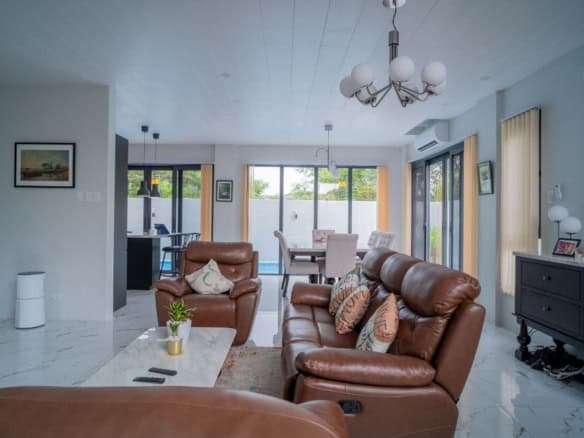 Interior view of a modern 4-bedroom villa living room in The Orchard Golf and Country Club, Dasmarin.