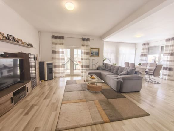 Bright living room with modern decor and large windows in a 3-bedroom house close to Balchik and the.