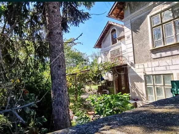 Two-storey house with spacious garden and mature trees in Aleksandrovo Village, Bulgaria.