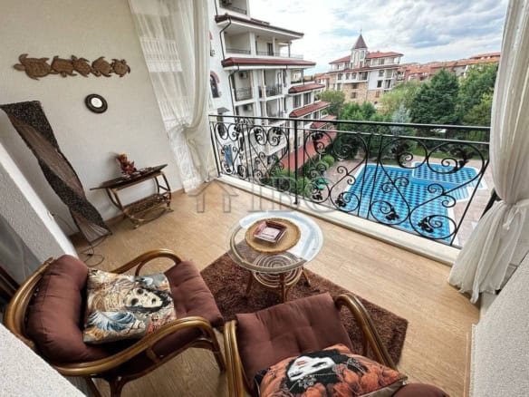 Balcony view of a luxury two-bedroom apartment in Esteban Complex, Nessebar, overlooking a swimming.