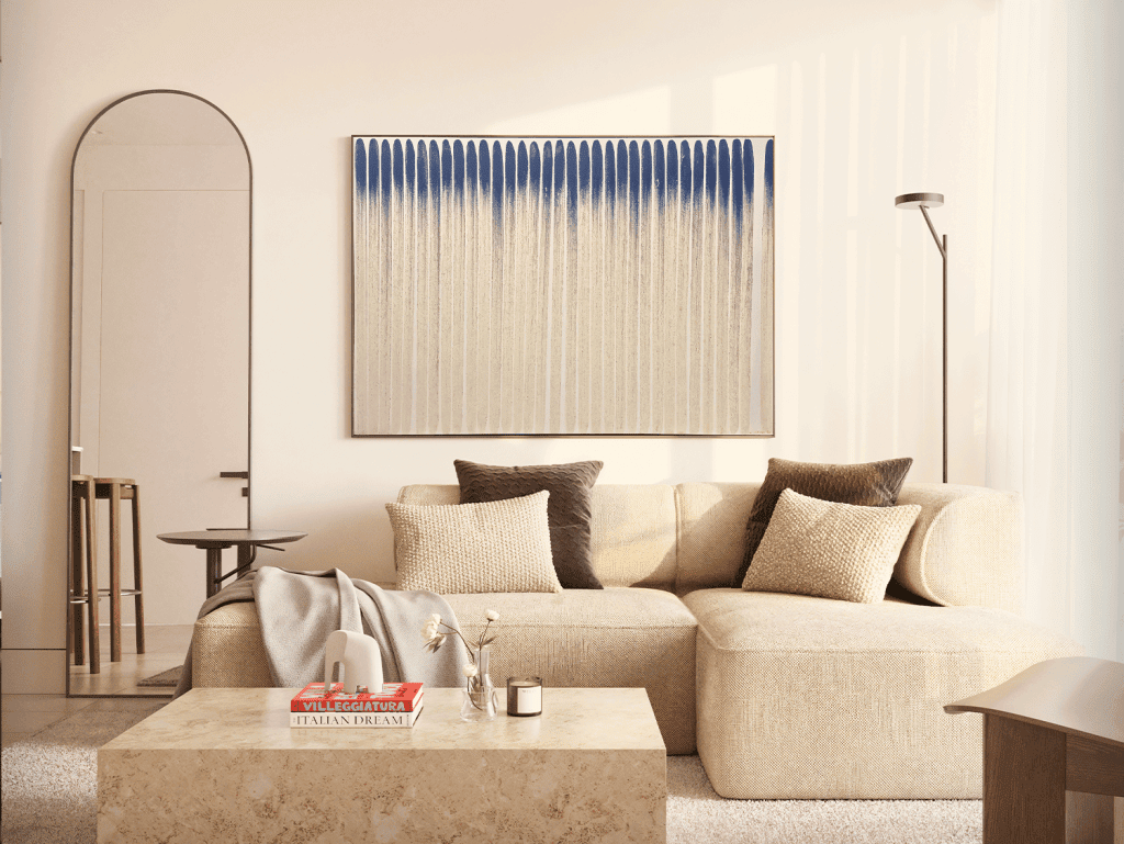 Elegant living room with comfortable sofa, artwork, and contemporary lighting.