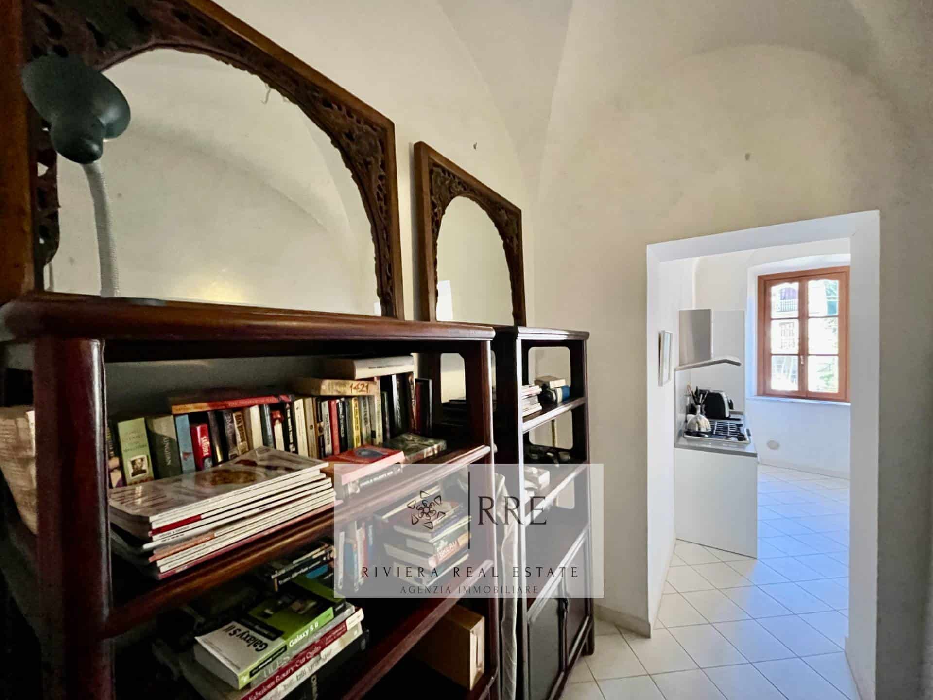 Historic home interior with bookshelves and vintage decor.