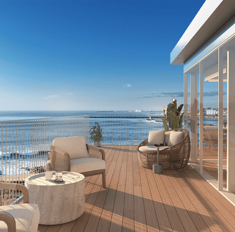 Balcony overlooking the Atlantic Ocean in Sal D'ouro, Porto, Portugal, with modern outdoor furniture.