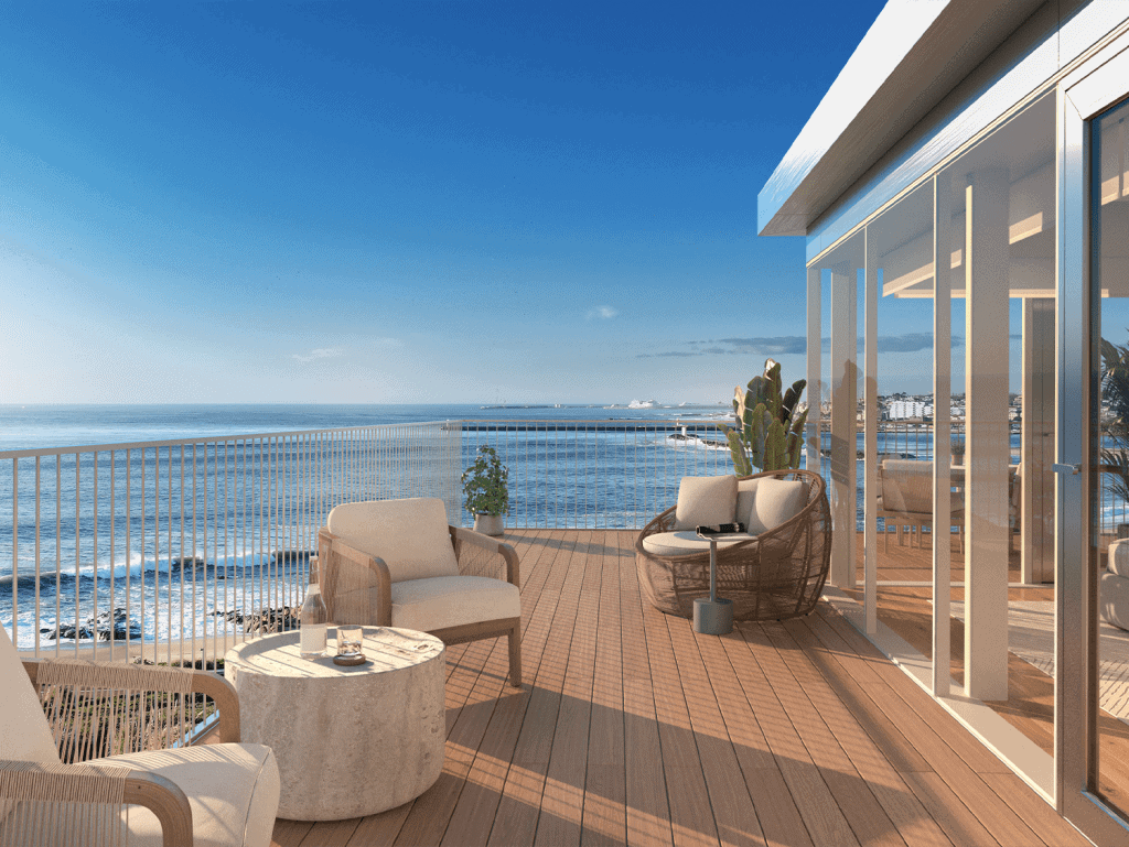 Balcony overlooking the Atlantic Ocean in Sal D'ouro, Porto, Portugal, with modern outdoor furniture.