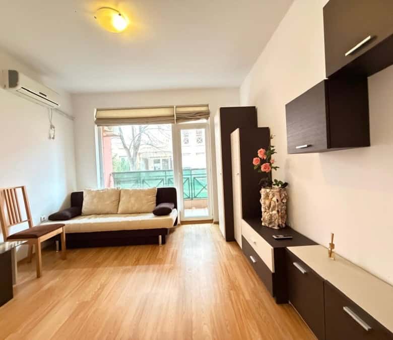 Bright 2-bedroom apartment with living room, balcony, and modern furnishings near Sunny Beach.