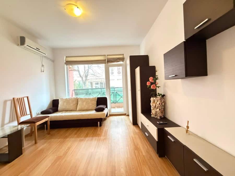 Bright 2-bedroom apartment with living room, balcony, and modern furnishings near Sunny Beach.