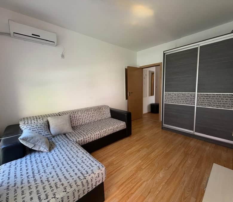 Bright 2-bedroom apartment with living room, wardrobe, and wooden flooring near Sunny Beach.