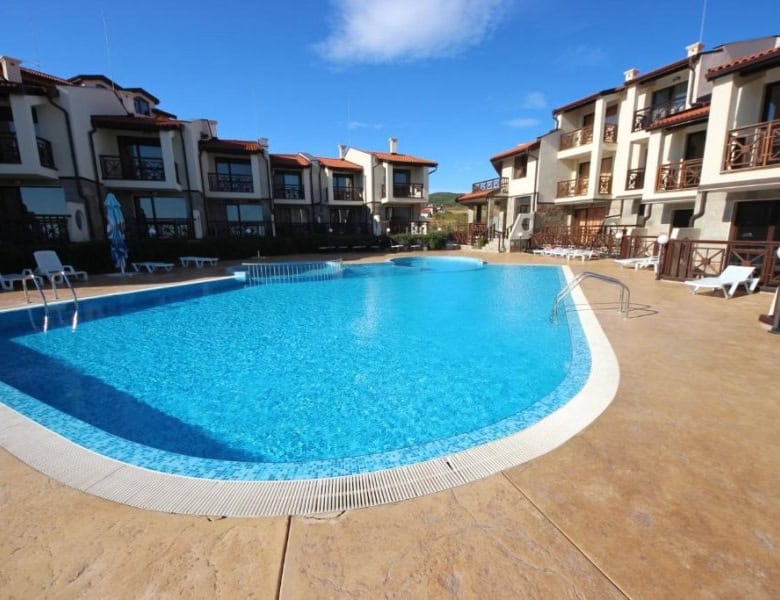 Pool area at Imperial Heights, Sunny Beach with residential buildings in the background.