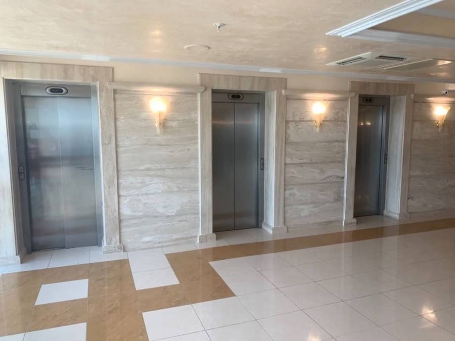 Modern elevator lobby in Sunset Resort, Pomorie with sea views and elegant lighting.