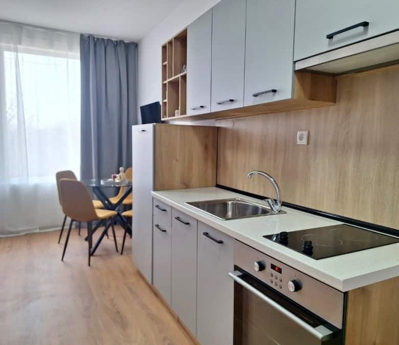 Bright, modern kitchen with appliances in Sunny Day 3 apartment.